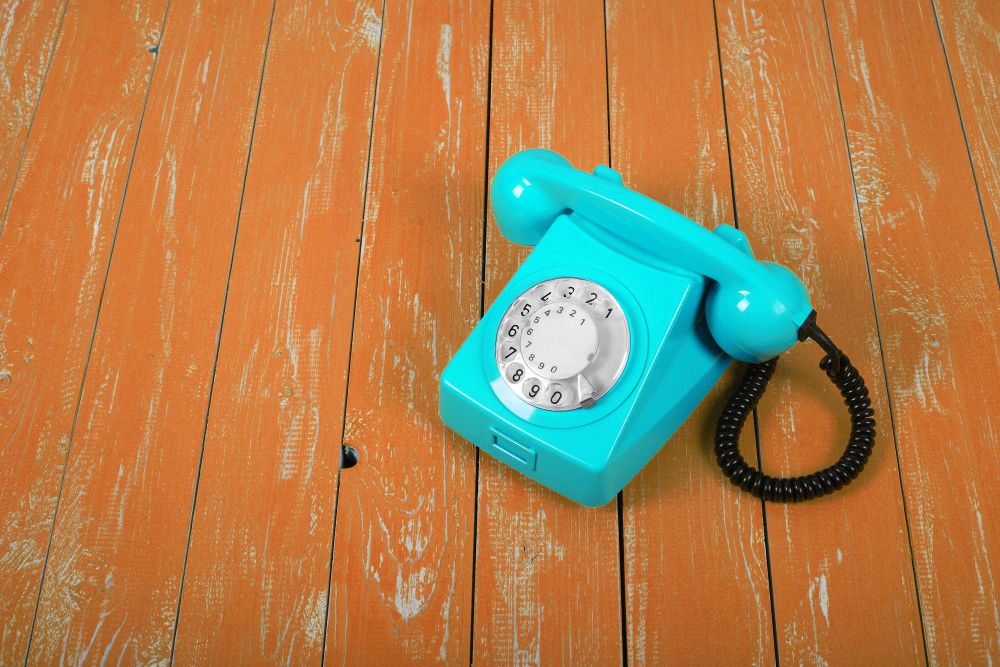 vintage-phones-blue-retro-telephone-orange-background